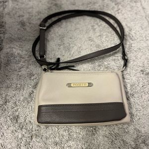 4/$25 Rosetti crossbody purse. Cream and black in color.